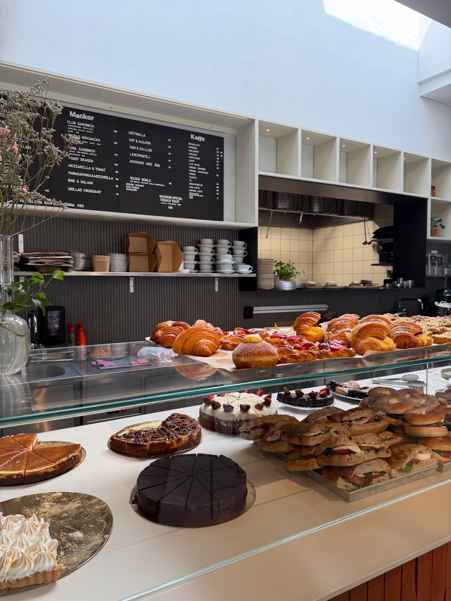 A café displaying baked goods in Hagastaden A café displaying baked goods in Hagastaden